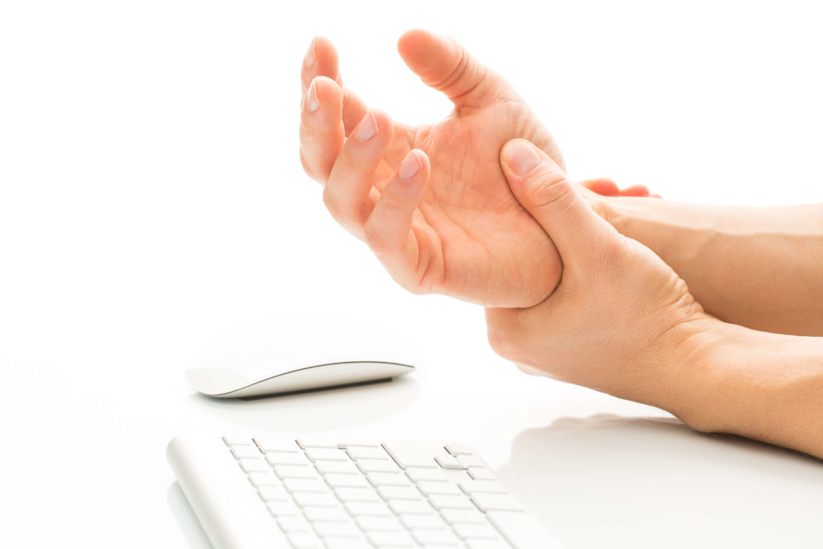 As depicted here, poor wrist placement while working at a computer might be one of the factors involved in the onset of carpal tunnel syndrome.