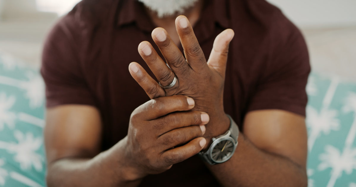 Why go to a hand specialist for arthritis treatment? There are many benefits of doing so, including greater expertise and a higher comfort level. This is a closeup image of a man massaging his hand.